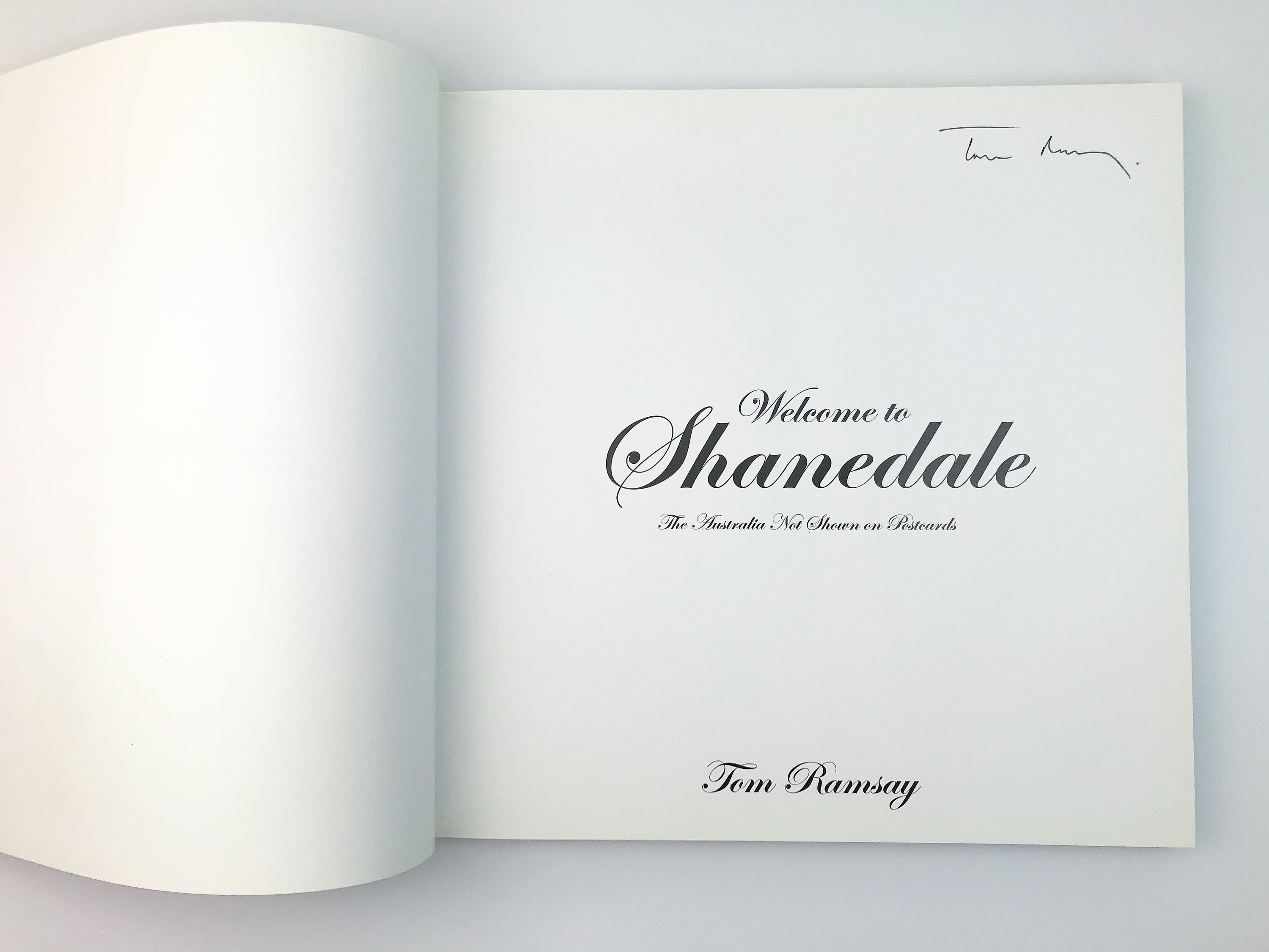 TOM RAMSAY: WELCOME TO SHANEDALE, THE AUSTRALIA NOT SHOWN ON POSTCARDS [2006] — SIGNED COPY
