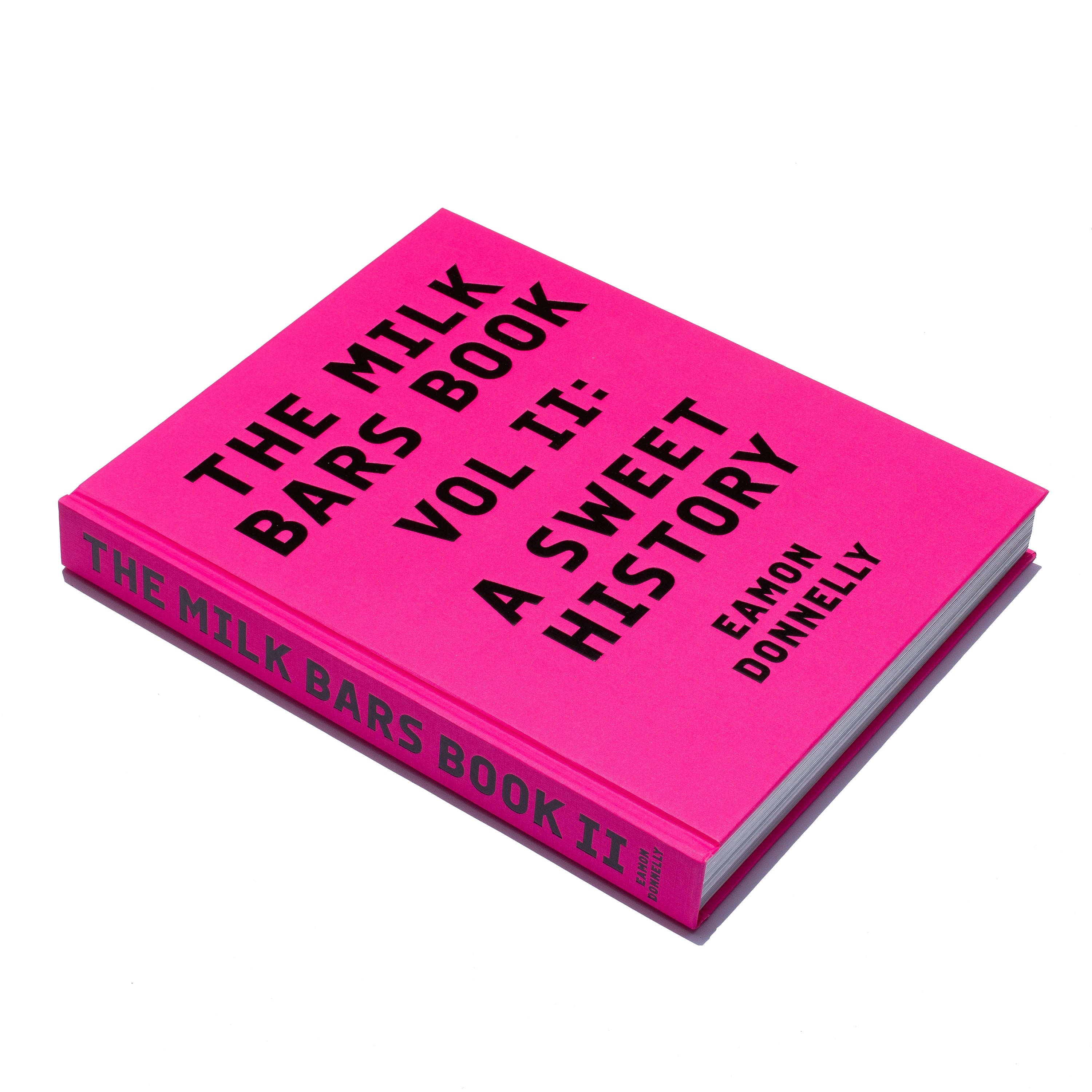 DISCOUNTED SECONDS STOCK of The Milk Bars Book. Volume II: A Sweet History [2023] — minor factory / carton damage, smudge, defect or scuff on the cover, spine, internal pages or end papers, otherwise “as new”